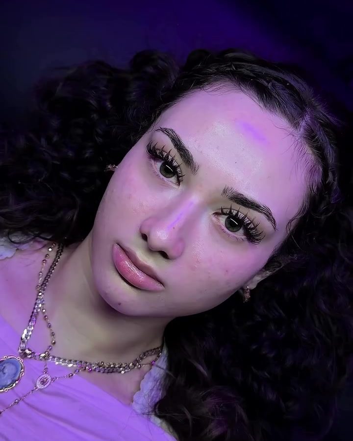 Client with a fresh anime set under purple suite lights